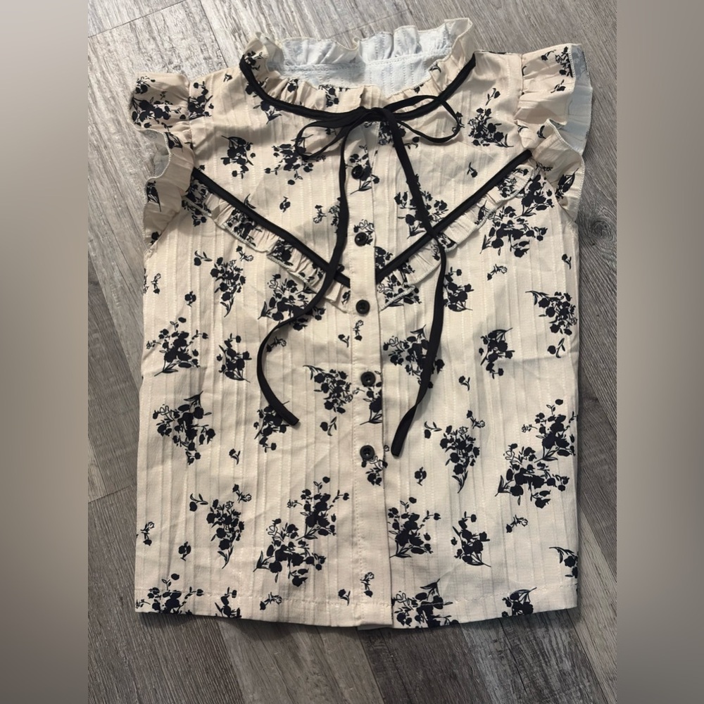 Ruffled Sleeveless Blouse